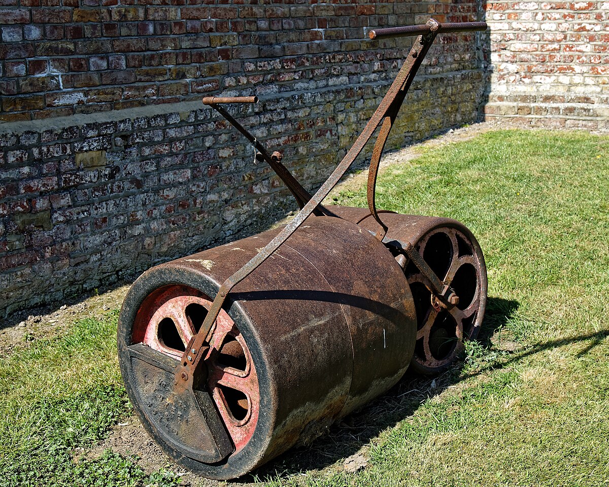 A lawn roller on green grass